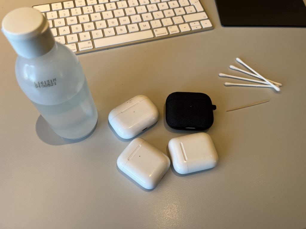 Picture of airpods and materials needed for cleaning (q-tip, toothpick, isopropyl alcohol)
