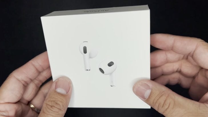 Photo of person holding an unopened box of airpods 3