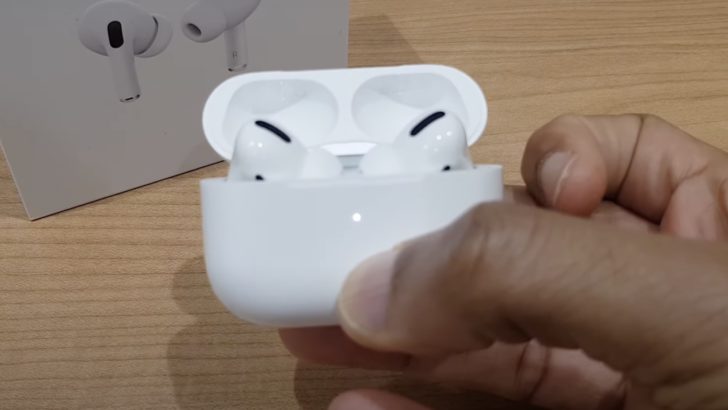 Photo of person setting up airpods case