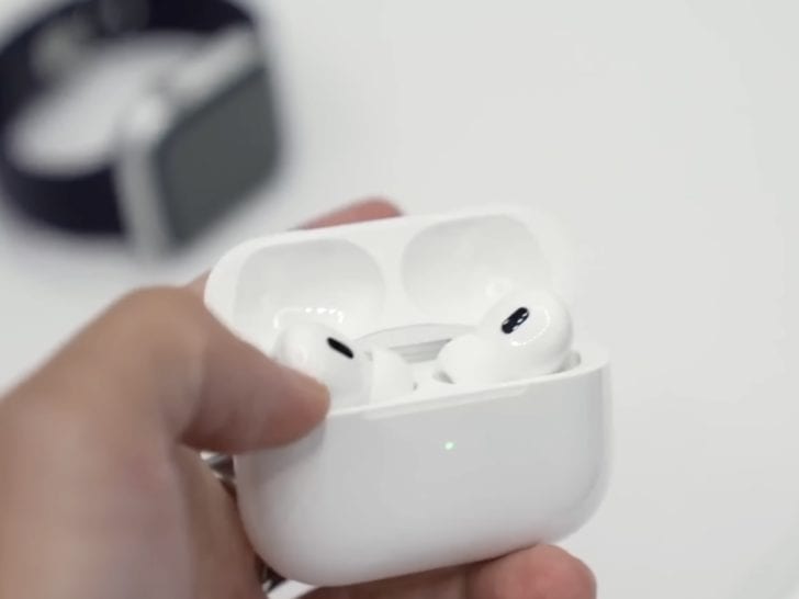 Photo of person holding airpods pro 2