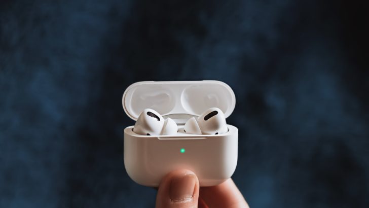 Photo of airpods in charging case with status light on