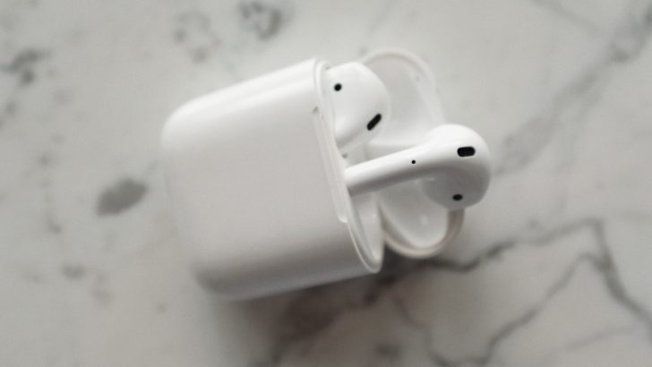 Photo of airpods inside the case with lid open