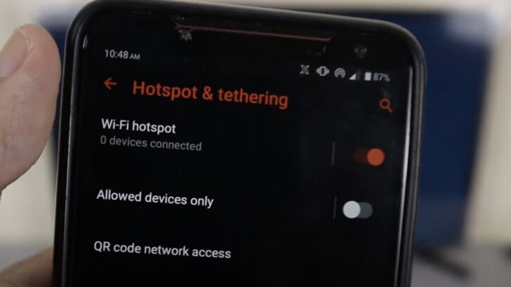 Photo of person turning wifi mobile hotspot on