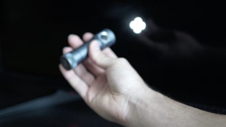 Photo of person using flashlight to check if vizio tv backlight is broken