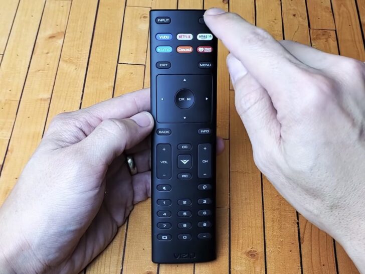 Photo of person holding vizio tv remote