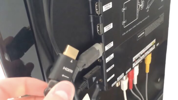 Photo of person unplugging hdmi cable from samsung tv