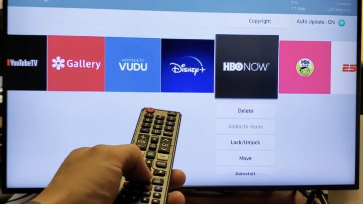 Photo of person deleting apps on samsung tv