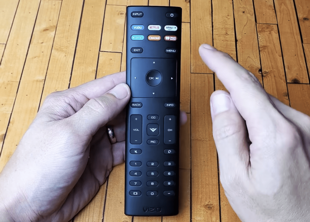 Photo of a person holding a new Vizio TV remote