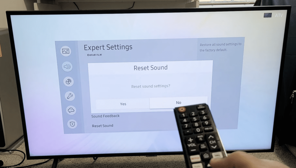 Photo of person resetting the sound settings of a samsung tv