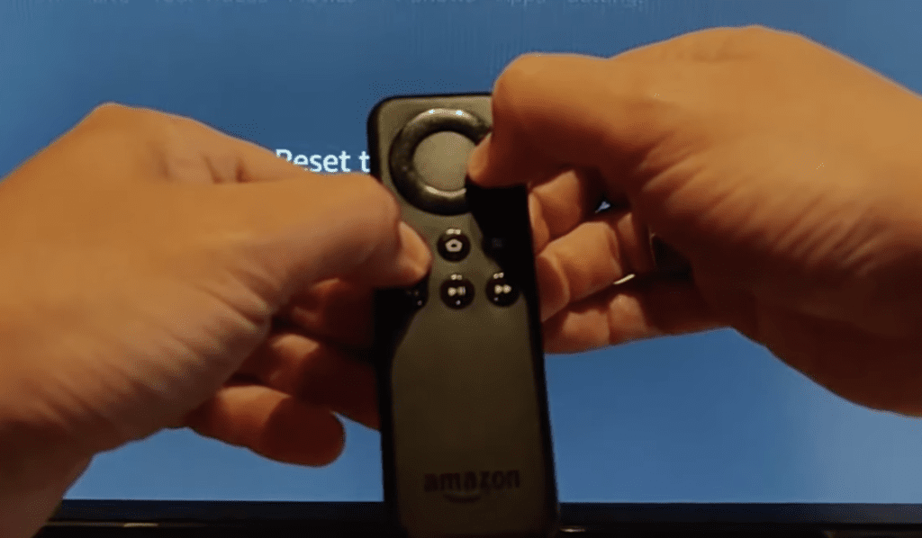 Photo of a person performing a factory reset using the Amazon Firestick remote