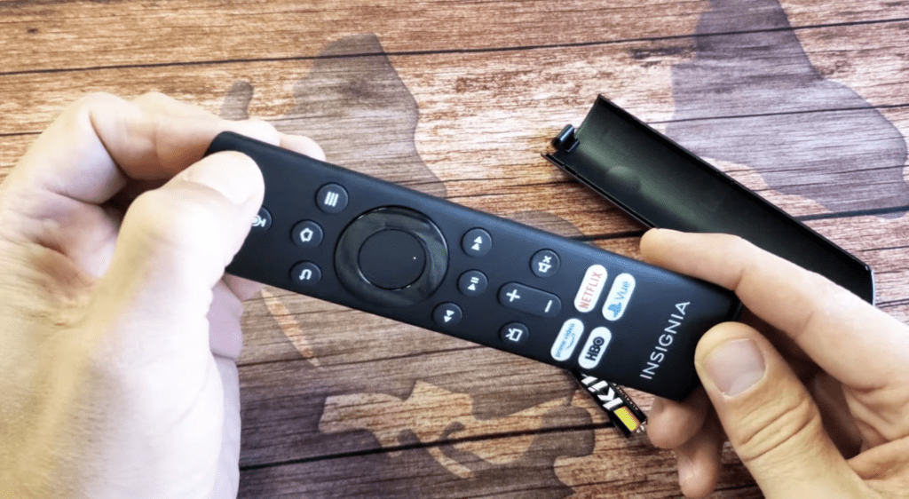 Photo of someone power cycling an Insignia TV remote