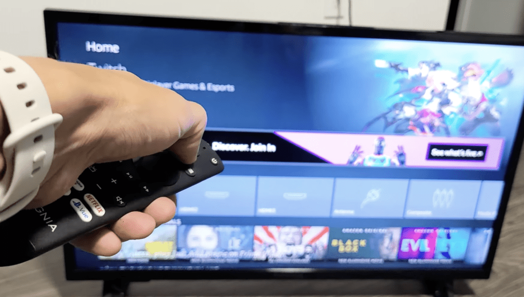 Photo of a person re-pairing an Insignia remote to an Insignia Fire TV