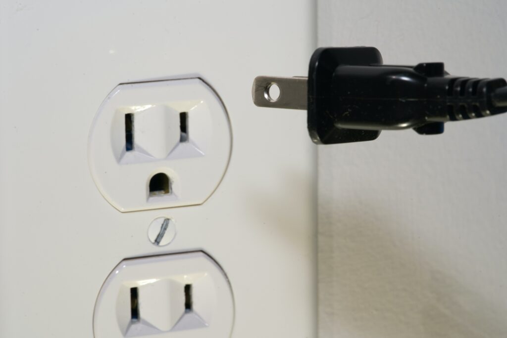 Photo of a power outlet and a power cord