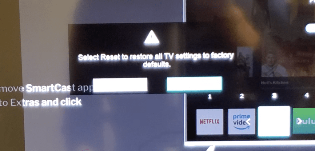 Photo of a Vizio TV prompt for restoring factory defaults