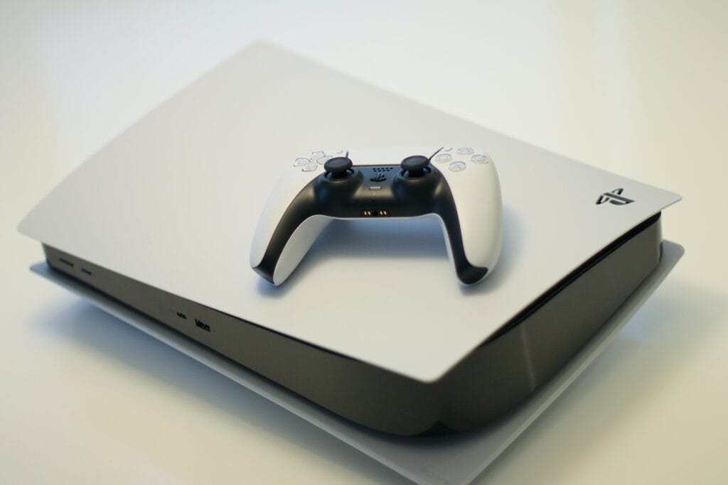 Photo of a PlayStation 5 with controller