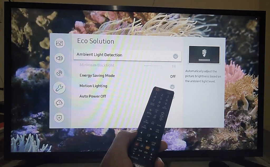 Photo of a person disabling the Ambient Light Detection feature on a Samsung TV
