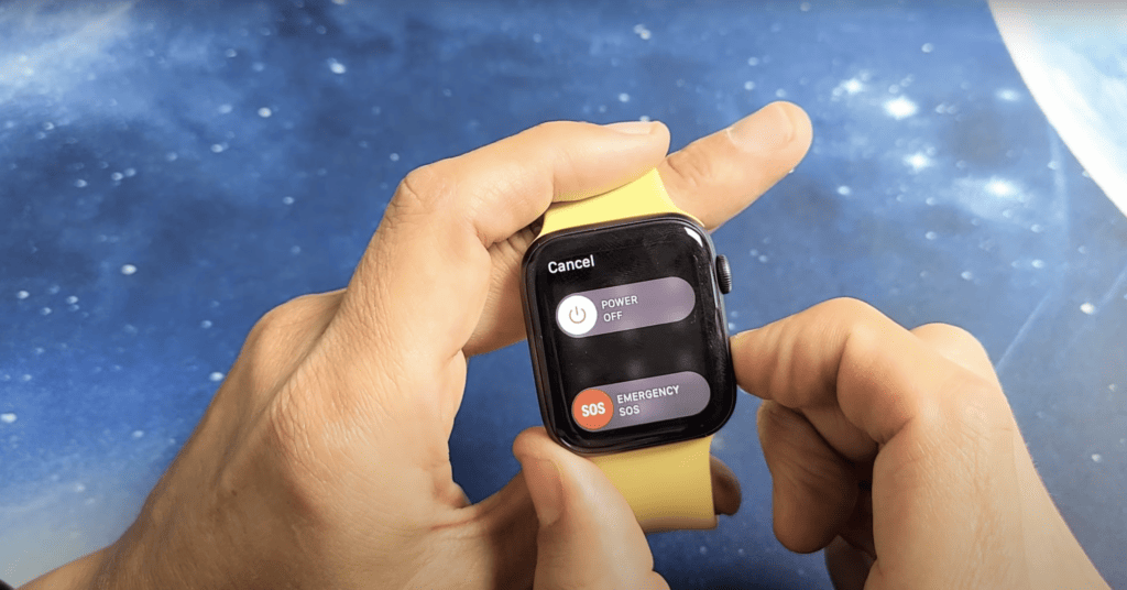 Man pressing the side of his Apple watch to show 