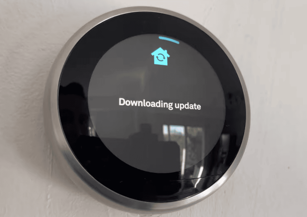 Photo of a Nest thermostat updating its software