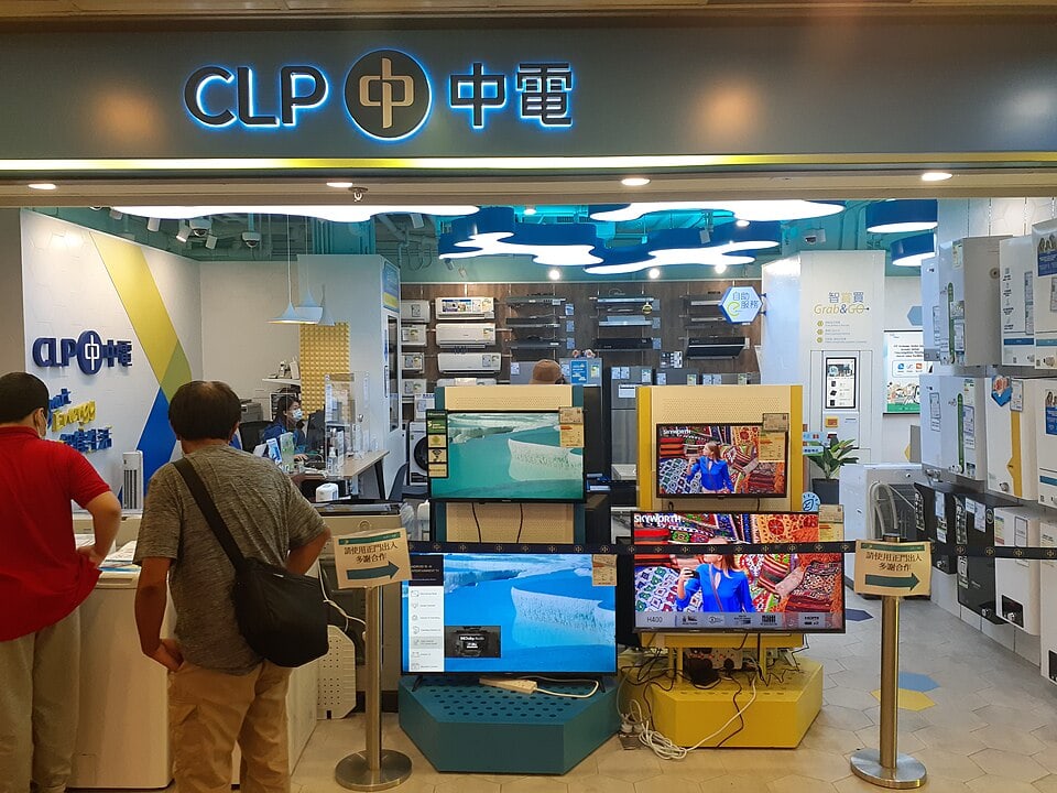 Two seniors looking at Hisense TV displayed in a store