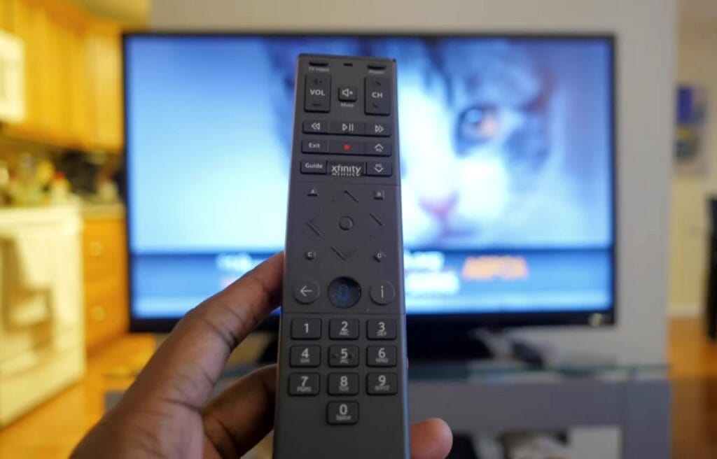 man holding an Xfinity XR15 remote