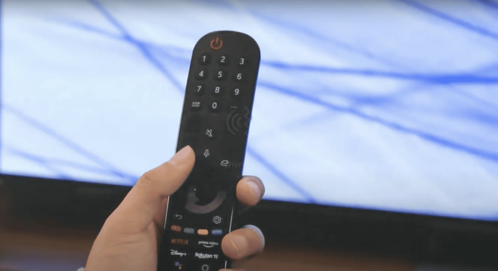 LG TV remote pointing on the television