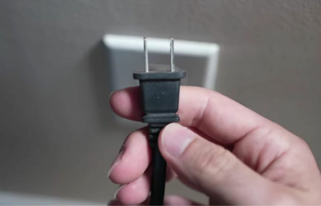Power cord remove from an outlet