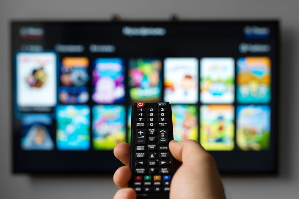 holding a universal smart TV remote 