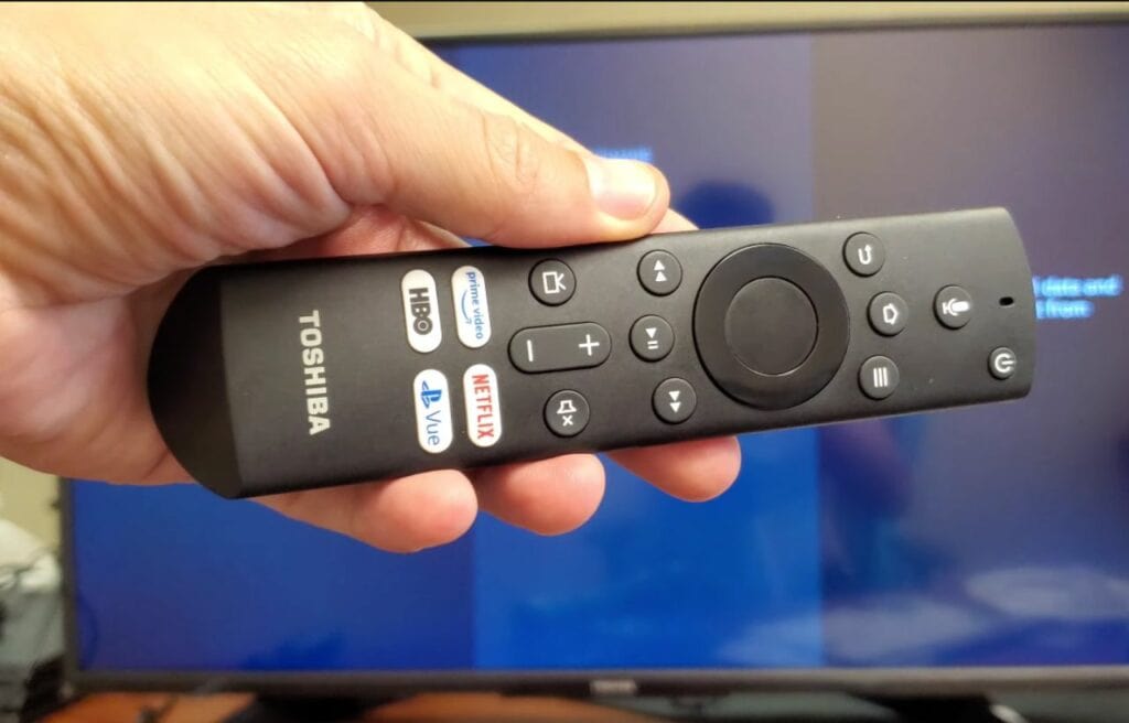 hand holding a Toshiba fire TV remote