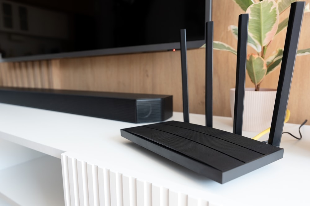 Wi-Fi router and soundbar on table